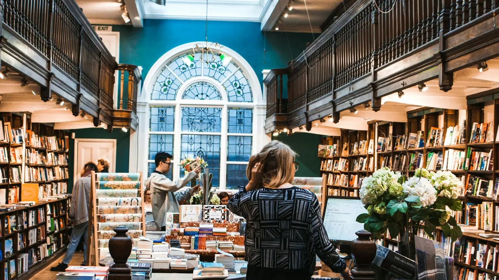 books on display — people inside library